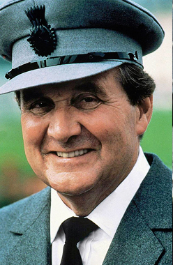 Patrick Macnee as Sir Godfrey Tibbett