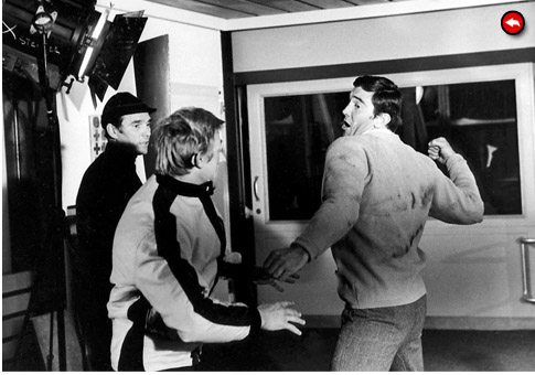 Lazenby throws a punch!