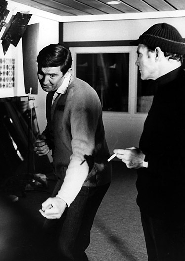 George Lazenby rehearses a fight scene with George Leech