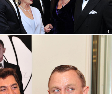 Skyfall director Sam Mendes shares a joke with Javier Bardem and Daniel Craig before introducing the cast inside the Royal Albert Hall.