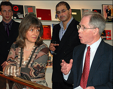 Corrine Turner watches William Smith introduce the evening