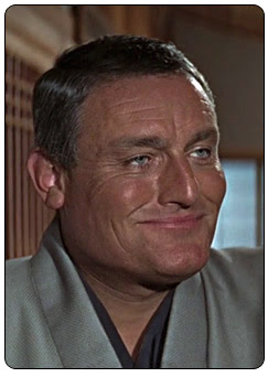 Henderson played by Charles Gray