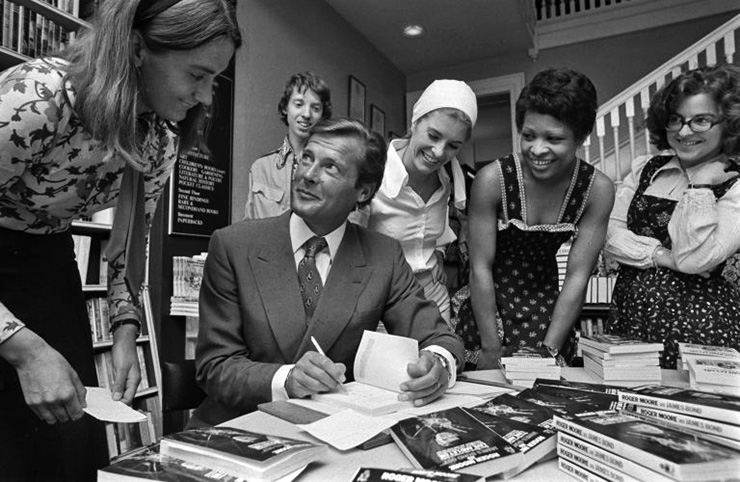 Roger Moore signs copies of his James Bond Diary
