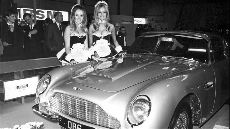Model Vivien Neves (1947-2002) [left] at the 1965 London Motor Show where the Aston Martin DB6 was launched. 