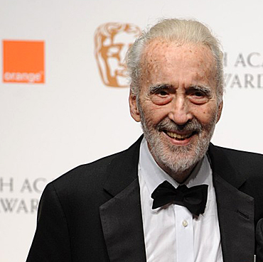 Sir Christopher Lee is presented with the BAFTA fellowship by Tim Burton