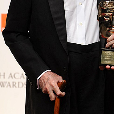 Sir Christopher Lee is presented with the BAFTA fellowship by Tim Burton