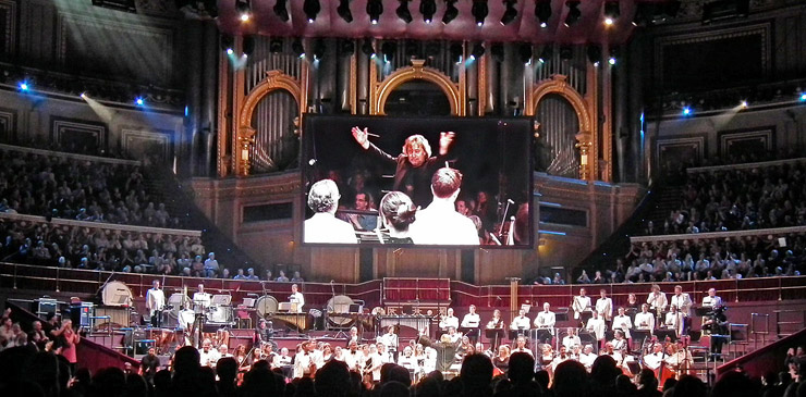 Conductor Nicholas Dodd bids the Royal Philharmonic Orchestra to stand and take a bow.