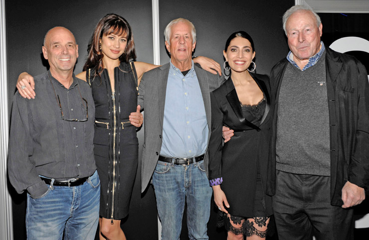 Director Martin Campbell, actress Olga Kurylenko, director Michael Apted, actress Caterina Murino, and director John Glen pose together to celebrate the 50th anniversary of James Bond and unveil Metro-Goldwyn-Mayer and Twentieth Century Fox Home Entertainment's BOND 50 Blu-ray collection at CES 2012 in Las Vegas