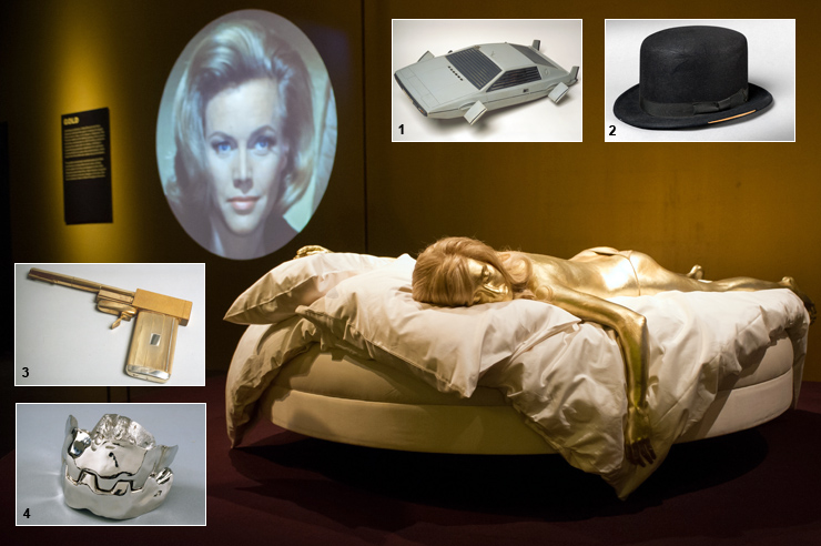 Life-size replica of Jill Masterson from Goldfinger (1964) and James Bond props and gadgets on display at Designing 007: 50 Years of Bond Style