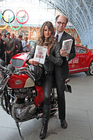 Jeffrey Deaver & Chesca Miles astride a BSA Spitfire motorbike