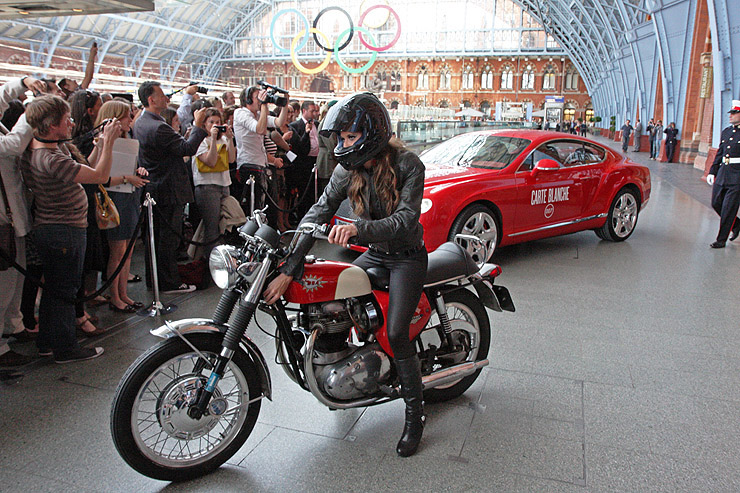 Chesca Miles rides a BSA Spitfire with Bentley Continental GT in the background