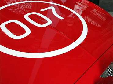 Red Bentley Continental GT with 007 logo