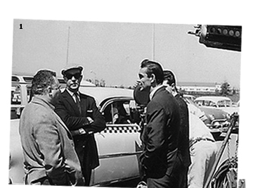 Harry Saltzman, Terence Young and Sean Connery chat on location