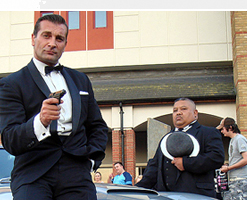 Donald Standen and Ian U'Chong pose with the Aston Martin DB5