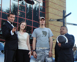 Donald Standen and Ian U'Chong pose with cinemagoers outside the VUE Cinema Staines