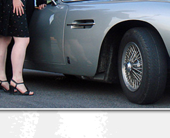 Donald Standen and Ian U'Chong pose with the Aston Martin DB5