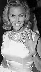 Honor Blackman wearing the specially comissioned Gold finger designed by Charles de Temple