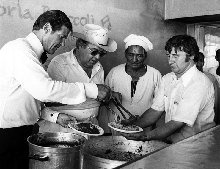 Roger Moore & Cubby Broccoli cook spaghetti for the crew of The Spy Who Loved Me in Cario